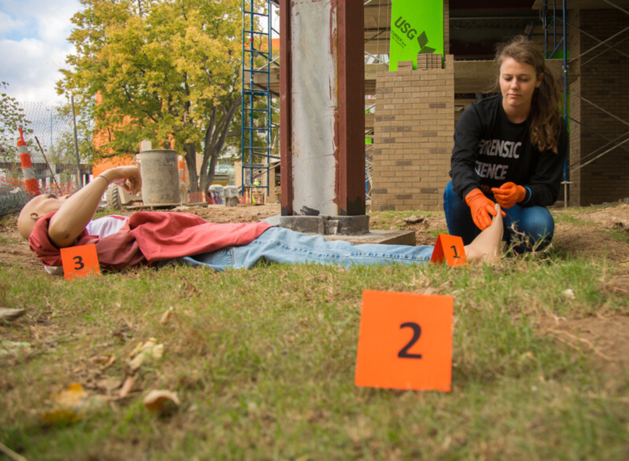 Student setting up a fake forensic investigation
