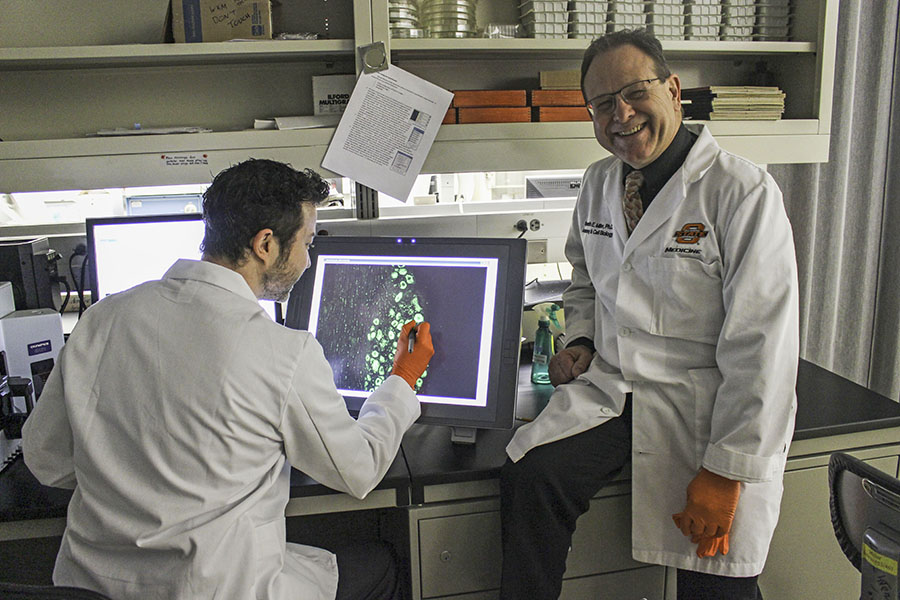 Professor and student in research lab