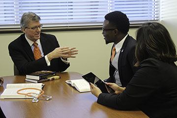 majors-testimonial-hca.jpg Dr. Jim Hess speaking with students