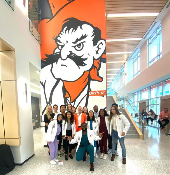 Student ambassadors show their OSU pride during the grand opening of the North Hall building. Student ambassadors show their OSU pride during the grand opening of the North Hall building.