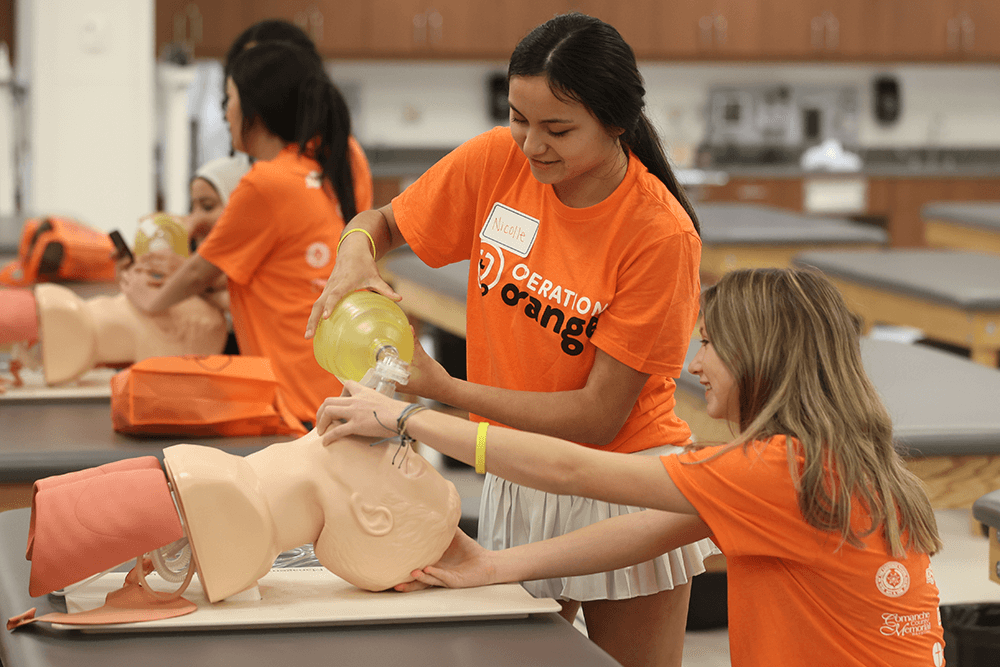 Students at Operation Orange participate at the airway management station during Operation Orange on the OSU Center for Health Sciences campus in Tulsa, Oklahoma.