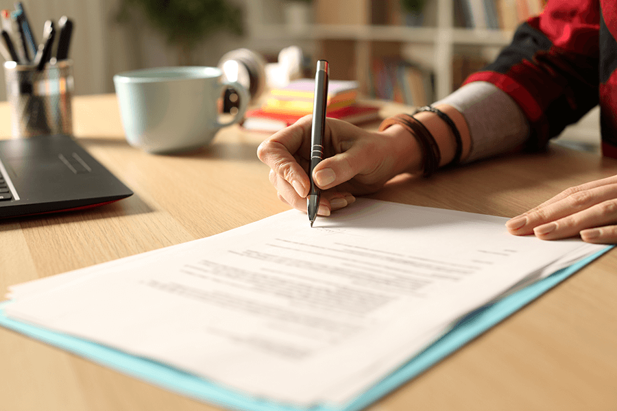 Employee working on contracts